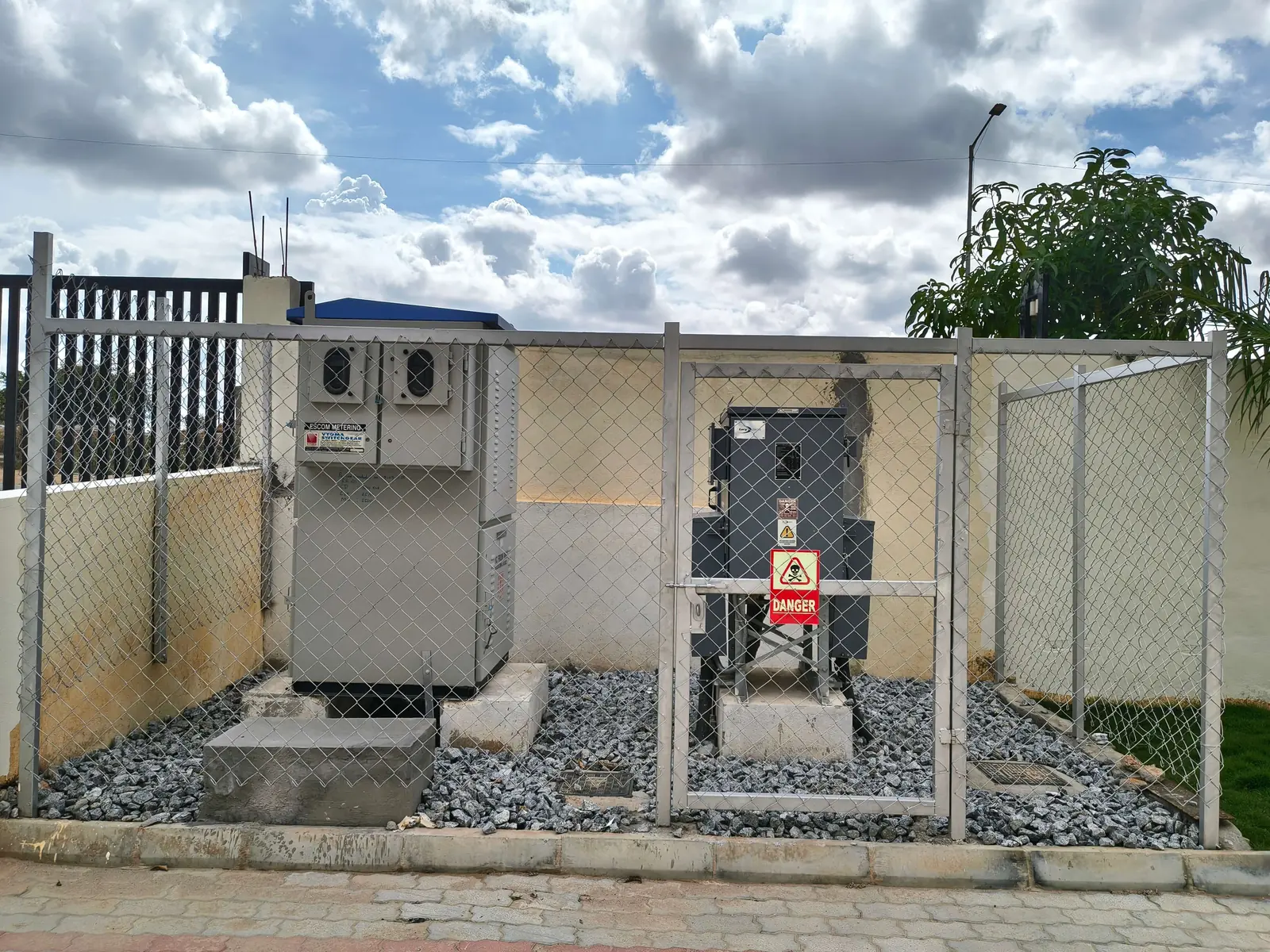 Fenced electrical kiosks in a compound