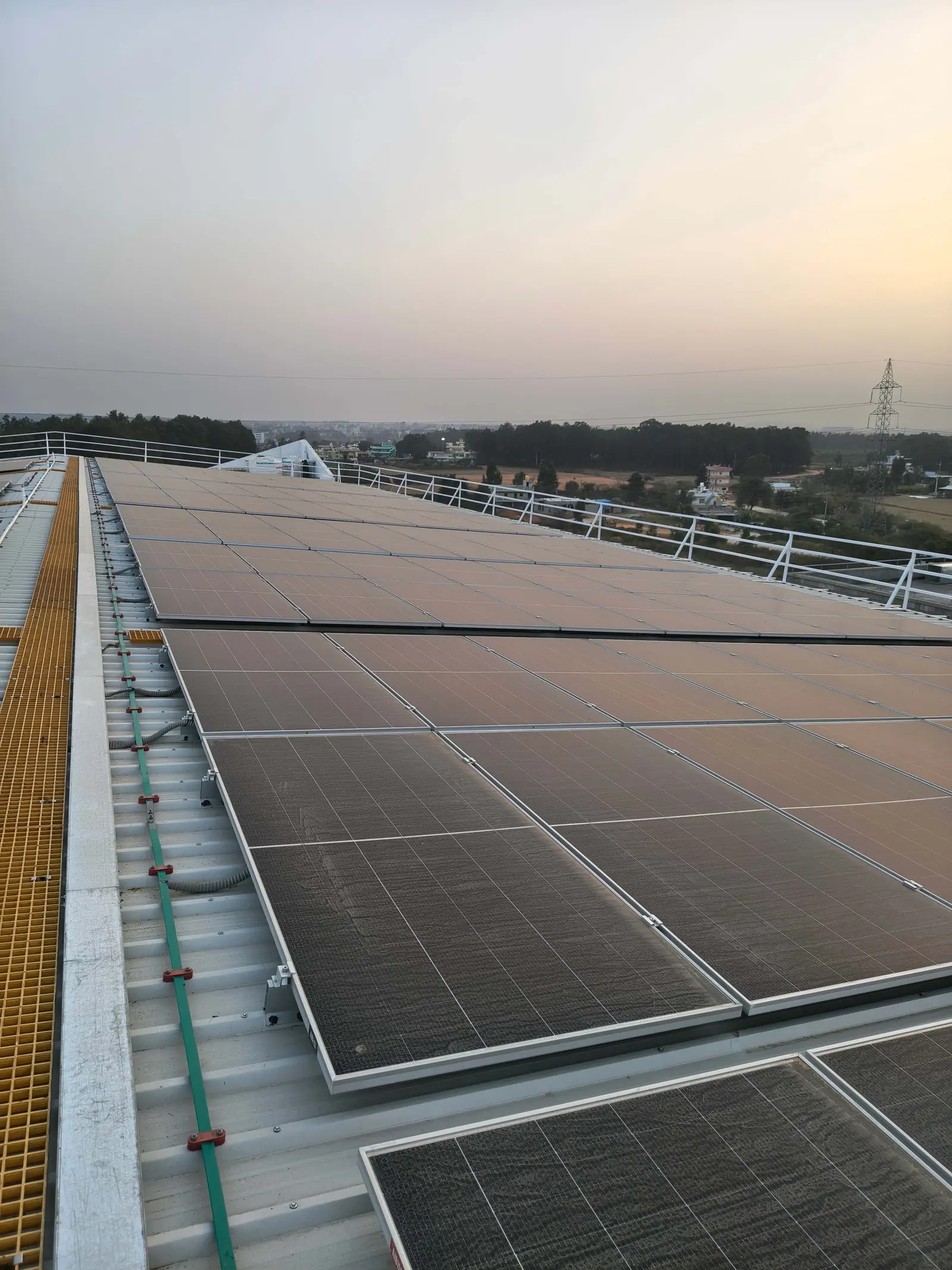 Rooftop solar panels at sunset
